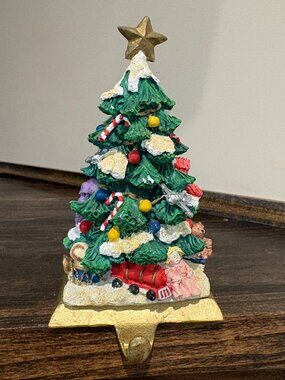 Vintage 3D Christmas tree cast iron stocking holder on a gold base